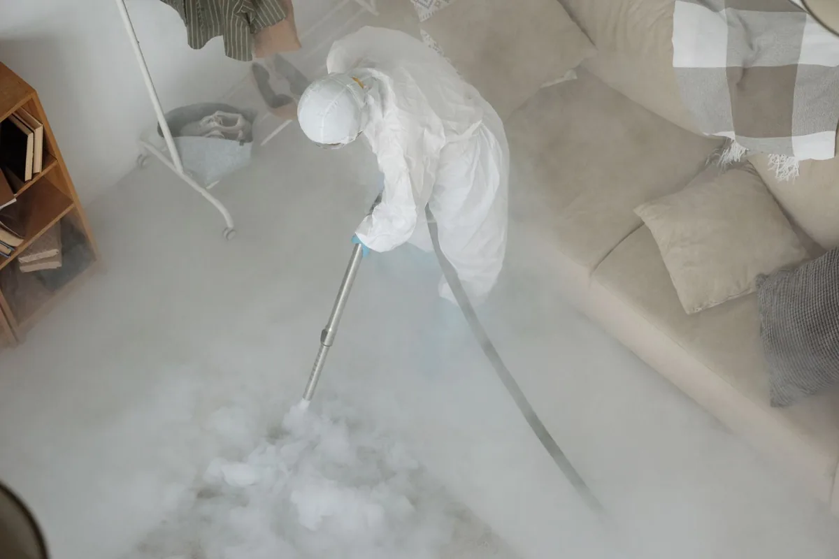 Biohazard cleanup technician in protective equipment, Waukesha, WI